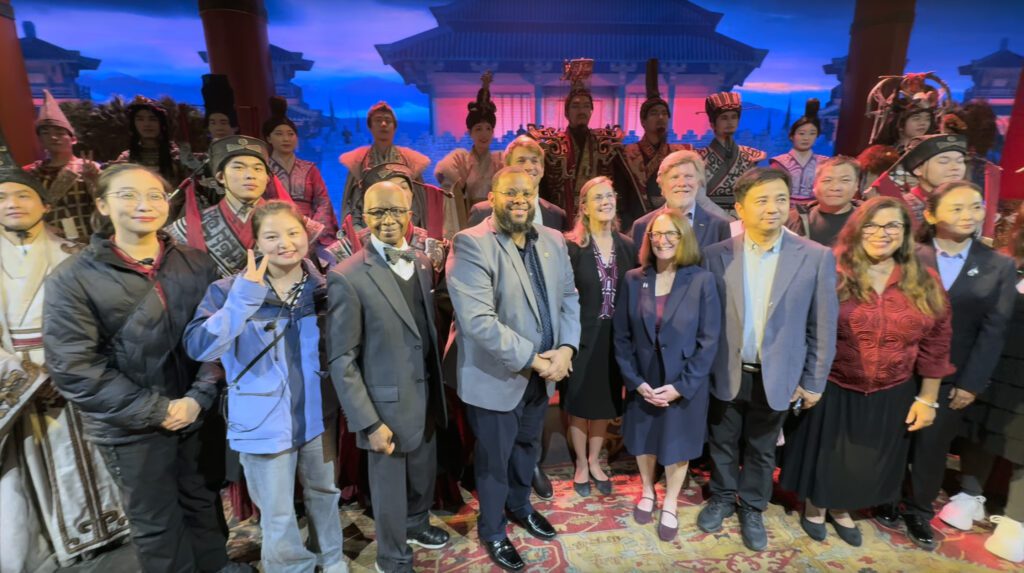 Members of the 2025 Heartland Leaders Delegation pose with performers after watching “The Great Qin.”